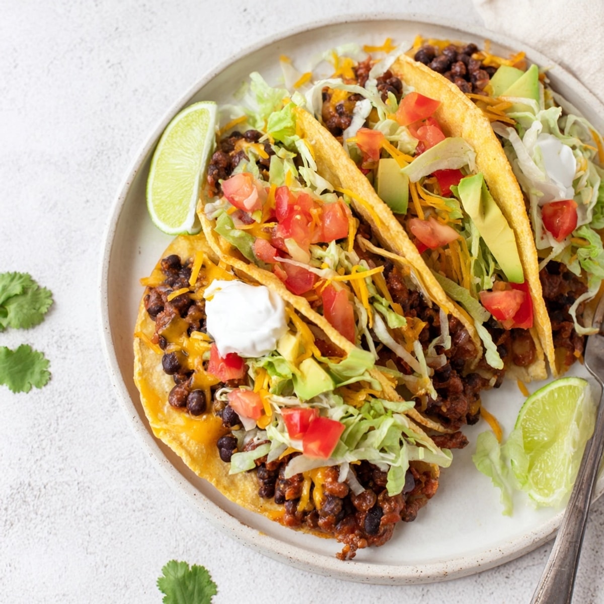 Overhead view of delicious Cheesy Cajun Black Bean Tacos: a flavorful, easy vegetarian meal.