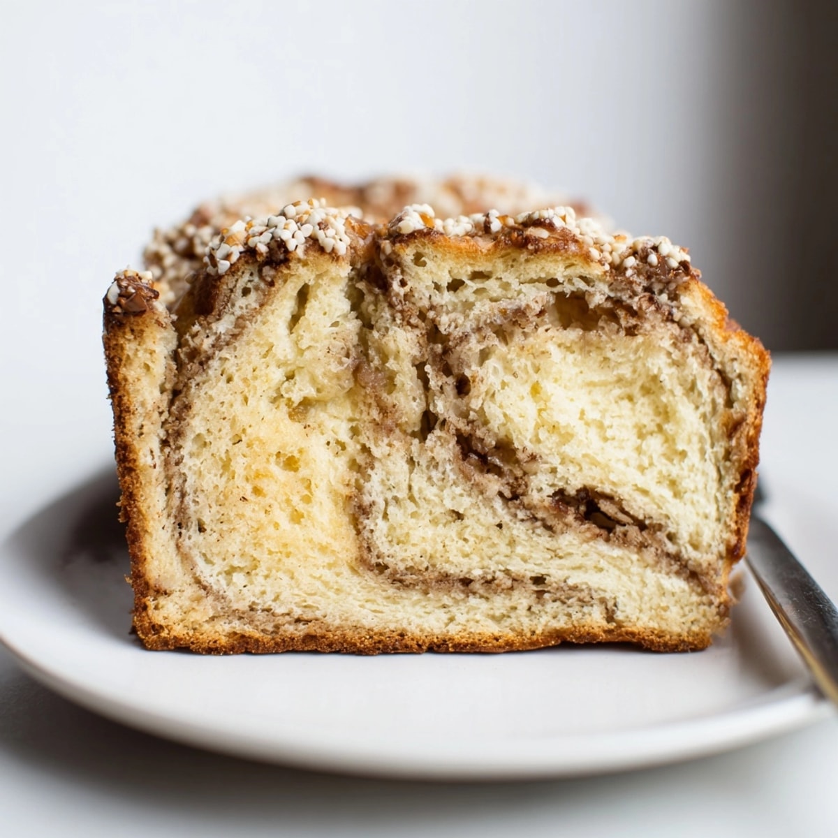 Warm, homemade Ricotta Vanilla Bean Bread loaf cooling, fragrant and waiting to be sliced.