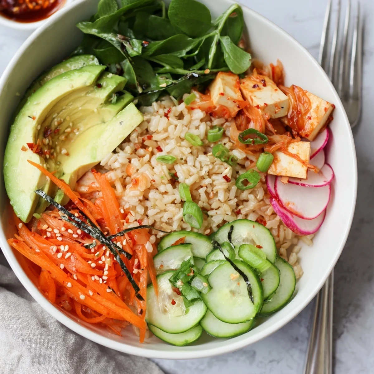 Nourishing fermented vegetable bowl featuring grains, vegetables, and a zesty dressing. 