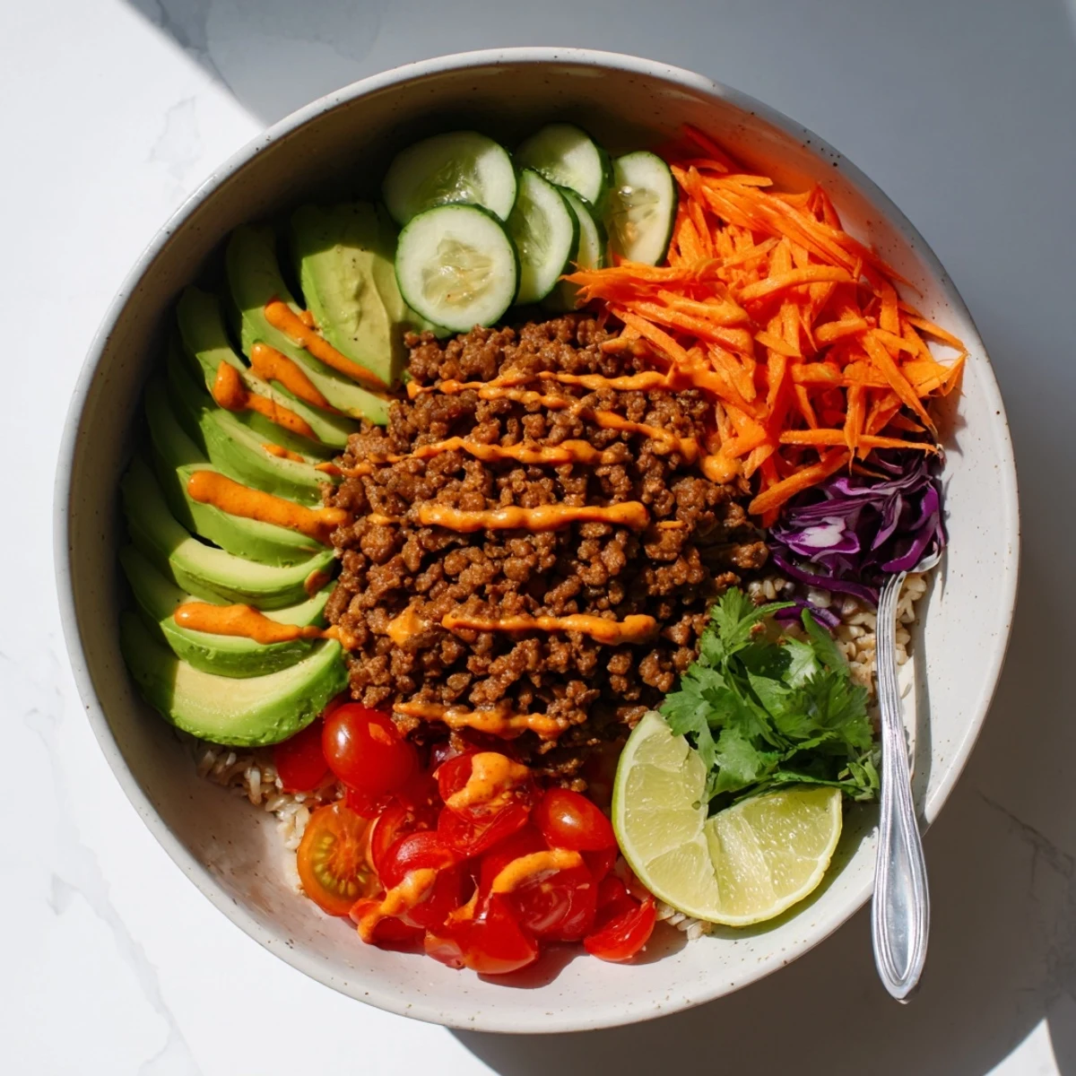 Hearty Plant-Based Meat Bowl bursting with spices, served over quinoa and veggies.  