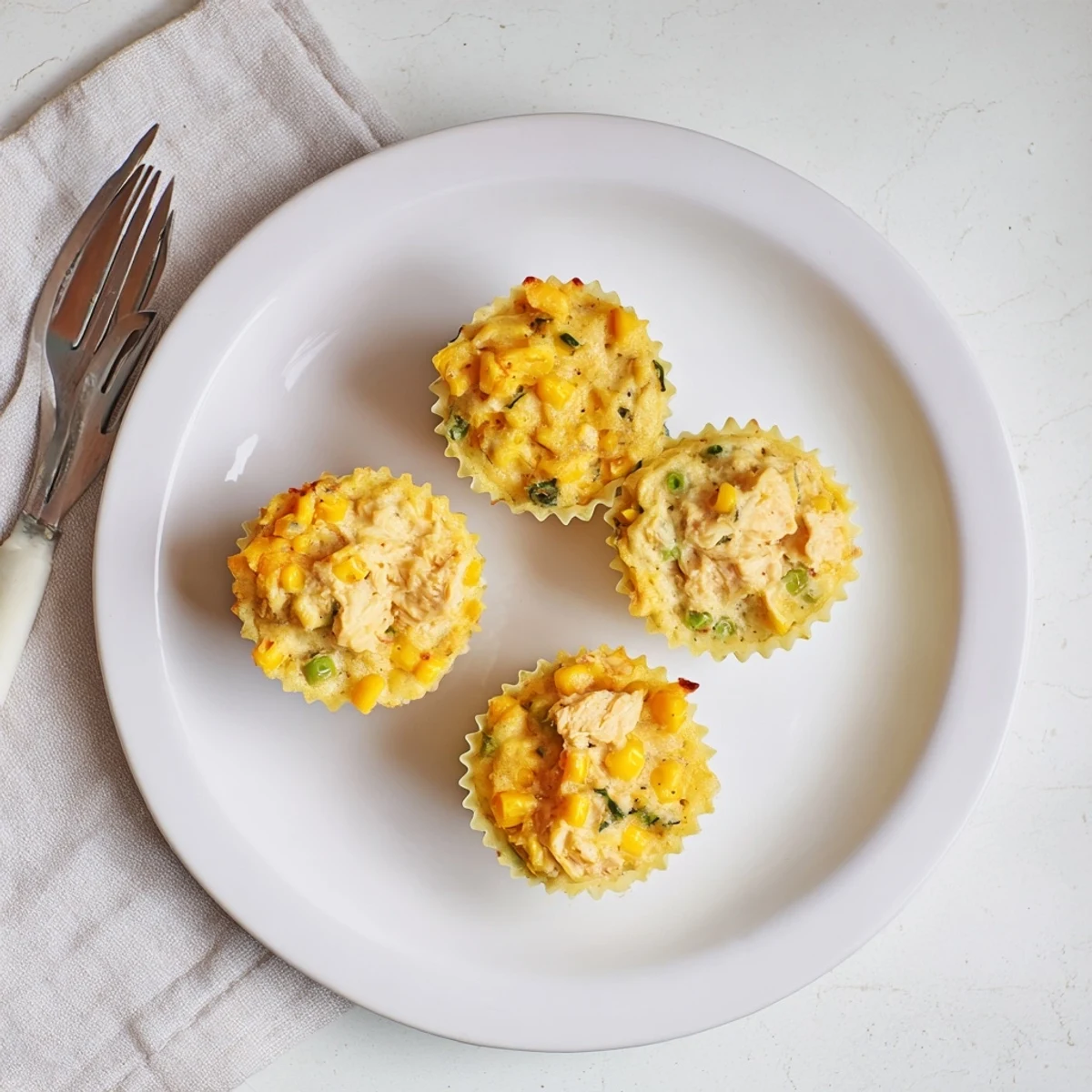 Golden-brown Mini Chicken Pot Pie Cornbread Muffins, warm and savory, ready to be enjoyed.