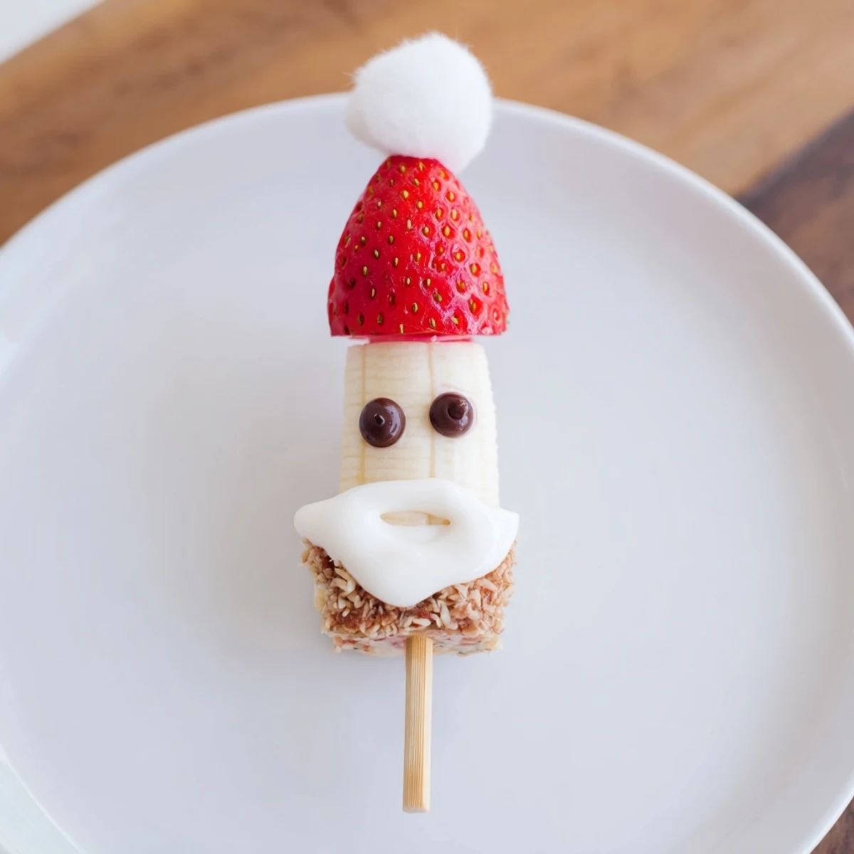 Vibrant Banana Strawberry Santa Skewers, easy to assemble; perfect holiday snack for kids, featuring banana and strawberry.