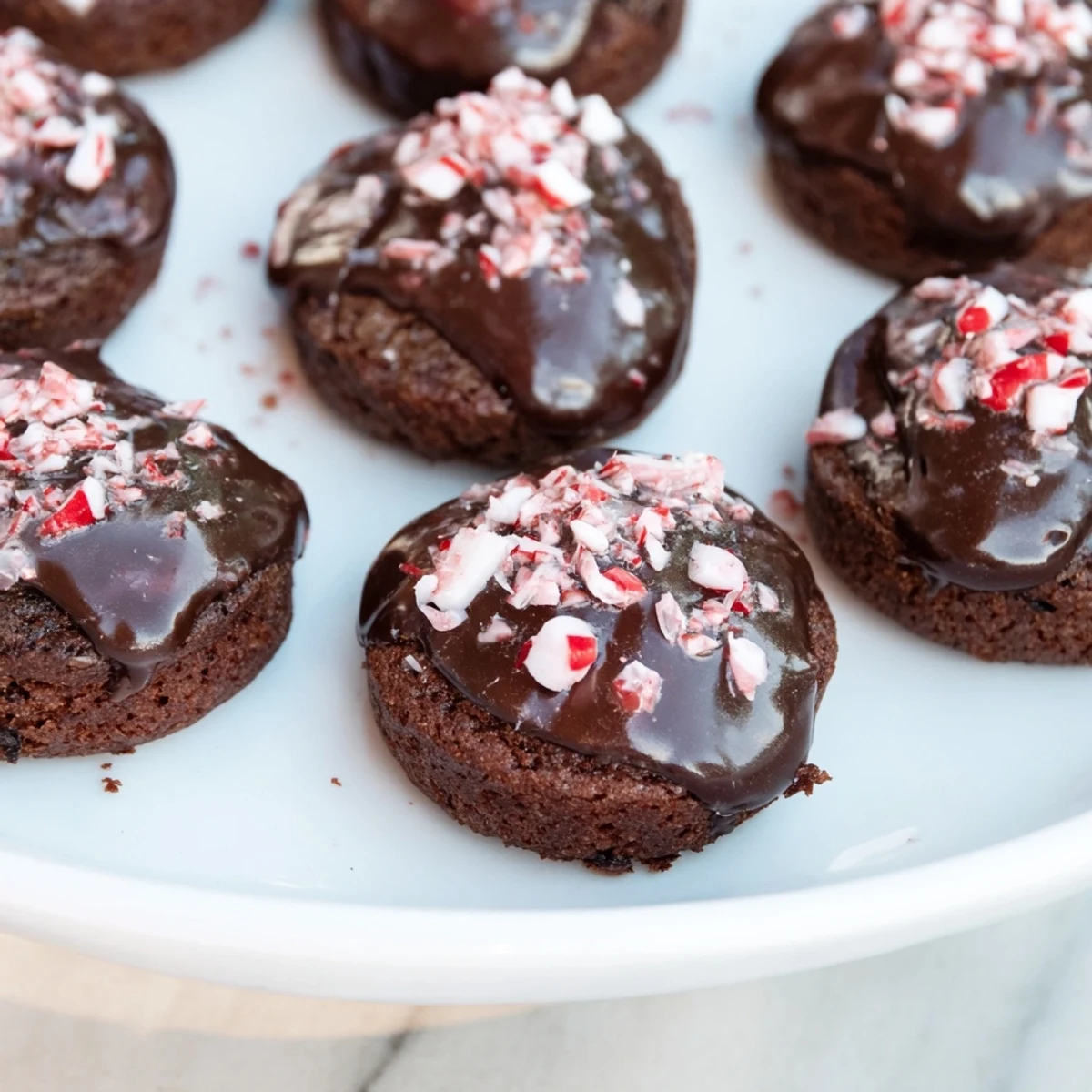 Festive photo of homemade Peppermint Mocha Brownie Bites, a decadent dessert perfect for holiday gatherings.