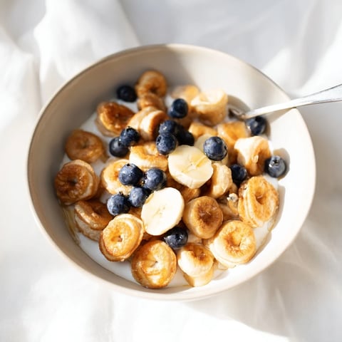 Delicious mini pancake cereal, golden brown and ready to top with fresh berries.  