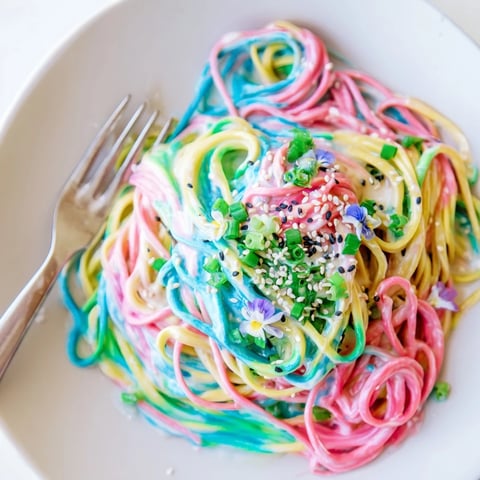 A vibrant Neon Noodle Cloud served in rich, creamy sauce and colorful hues.  