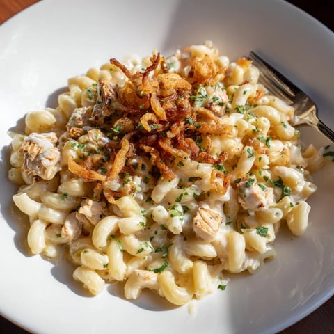 Creamy One-Pot Honey BBQ Chicken Mac and Cheese topped with crispy onions.  