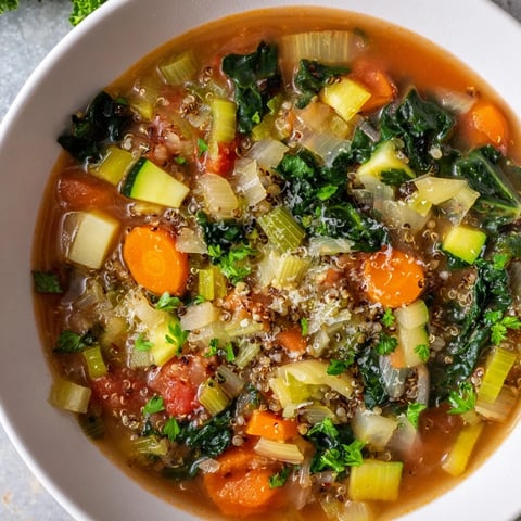 Savory Italian Minestrone with Quinoa, featuring vibrant greens and hearty vegetables in the soup.
