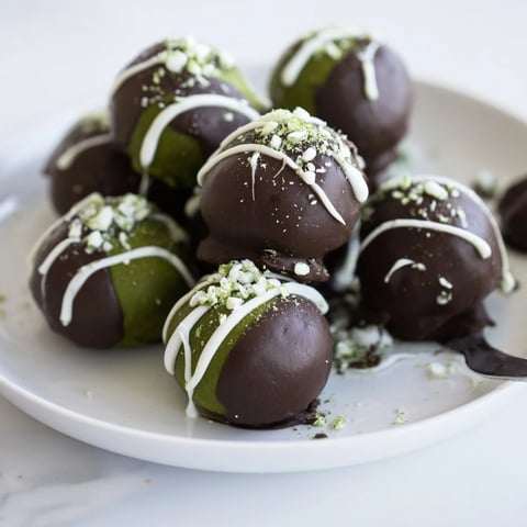 Decadent Matcha Dark Chocolate Peppermint Truffles, rolled in green matcha powder, ready to enjoy.