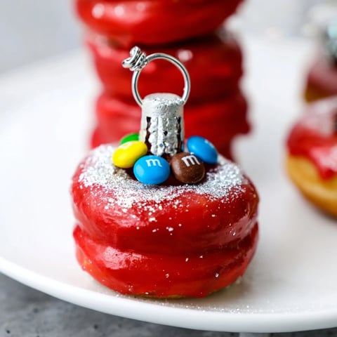Festive Donut Stack Christmas Ornament Tower, a delightful dessert with colorful, shimmering holiday decorations.