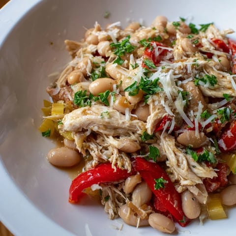 A flavorful bowl of White Bean and Roasted Red Pepper Chicken stew, perfect for a cozy dinner.
