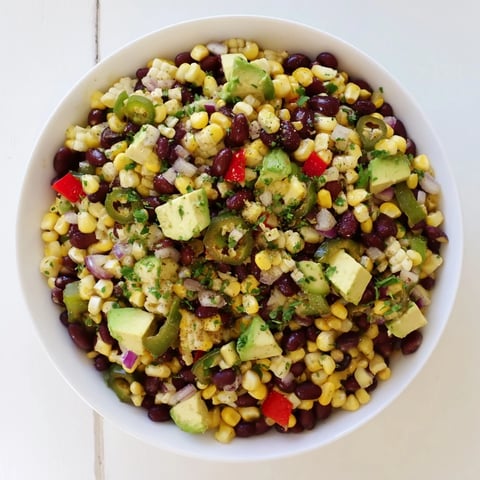 Vibrant Southwestern Black Bean and Corn Salad, a colorful mix with fresh cilantro, ready to eat.