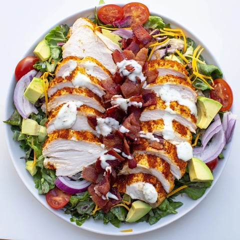 A delicious Crispy Bacon Chicken Salad with juicy grilled chicken and crunchy bacon, ready to enjoy.