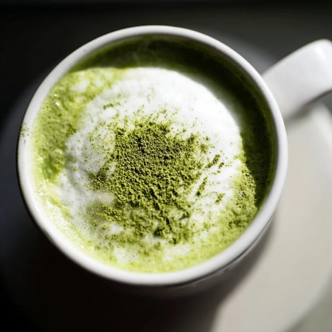 Creamy matcha green tea latte, a frothy, vibrant drink, ready to warm you up.