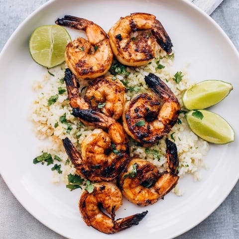 Smoky, grilled Chipotle Lime Shrimp & Rice served with fluffy rice, tempting and delicious.