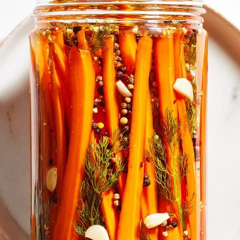 Showcasing vibrant, crisp Quick Pickled Carrot Spears, perfectly paired with a flavorful, easy brine.