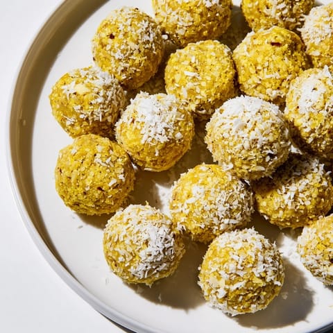Ginger Turmeric Energy Balls arranged in a rustic bowl, ready for a nourishing snack after a workout.