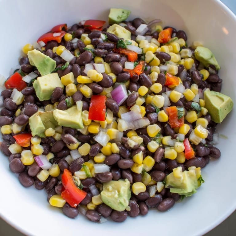 Enjoy a refreshing bowl of Southwestern Black Bean and Corn Salad, perfect for summer.